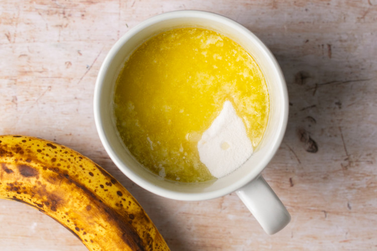 melted butter, sugar, banana and vanilla extract in a mug.