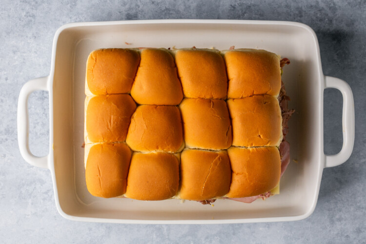 sliders in a white baking dish.