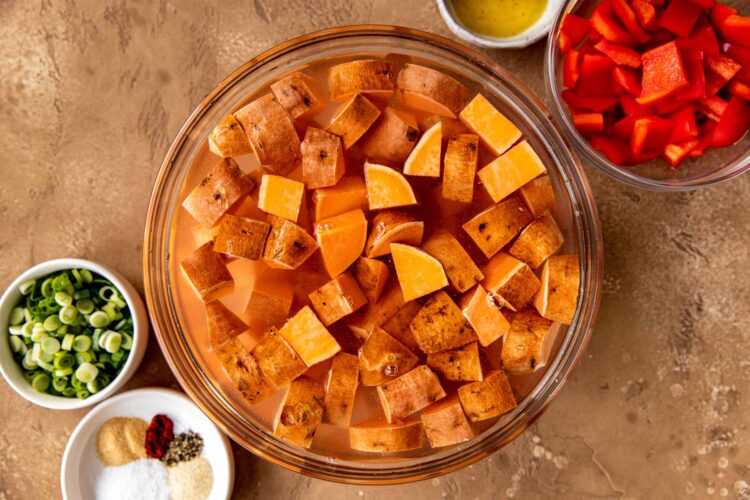 sweet potato cubes in a bowl with water.