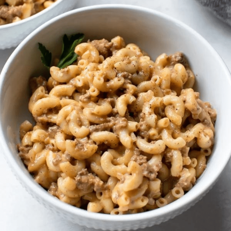 white bowl with macaroni noodles and ground beef