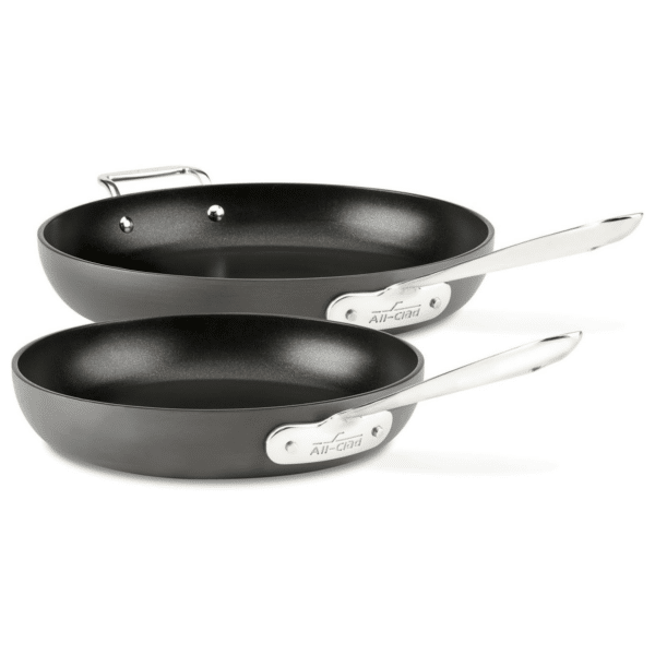 two black non stick pans with silver handles.