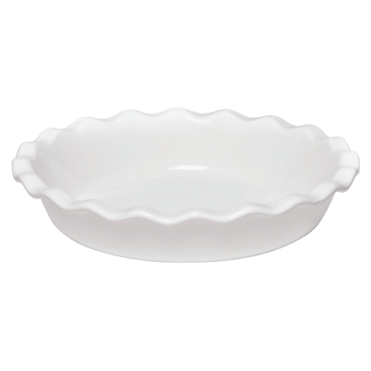 A white ceramic pie pan with scalloped edges.