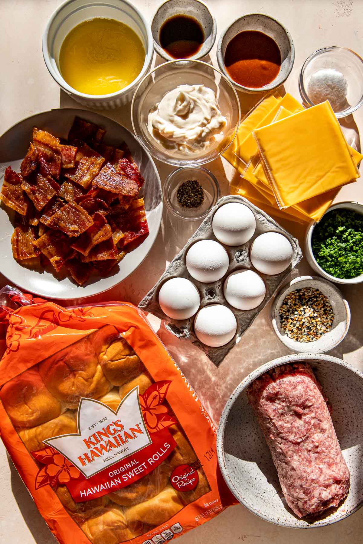 ingredients to make breakfast sliders in glass dishes. 
