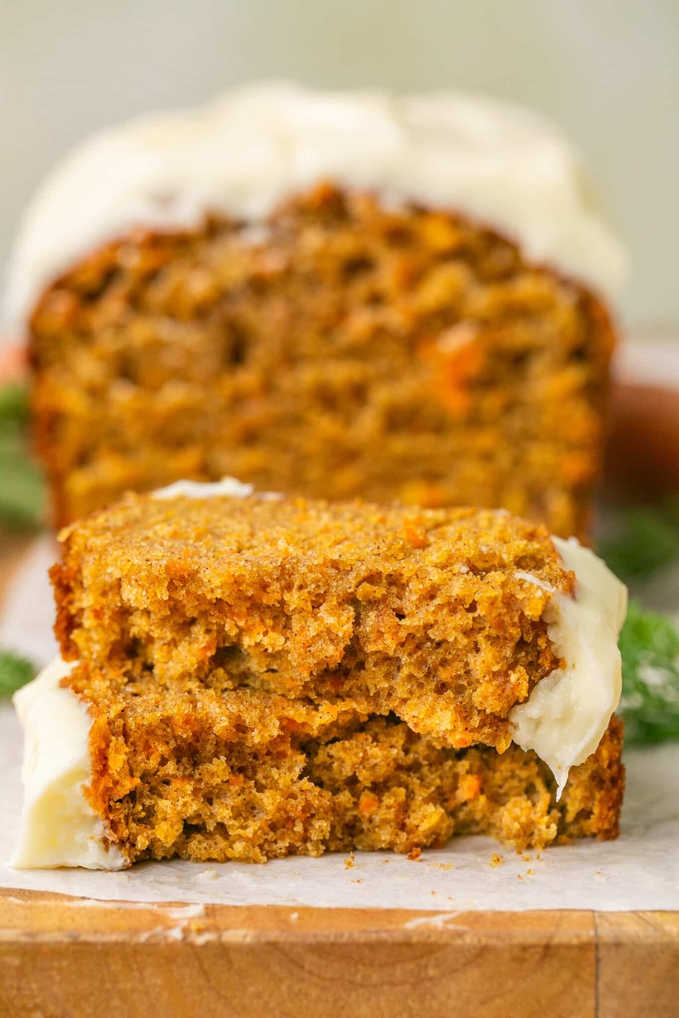 sliced carrot cake bread on a cutting board. 