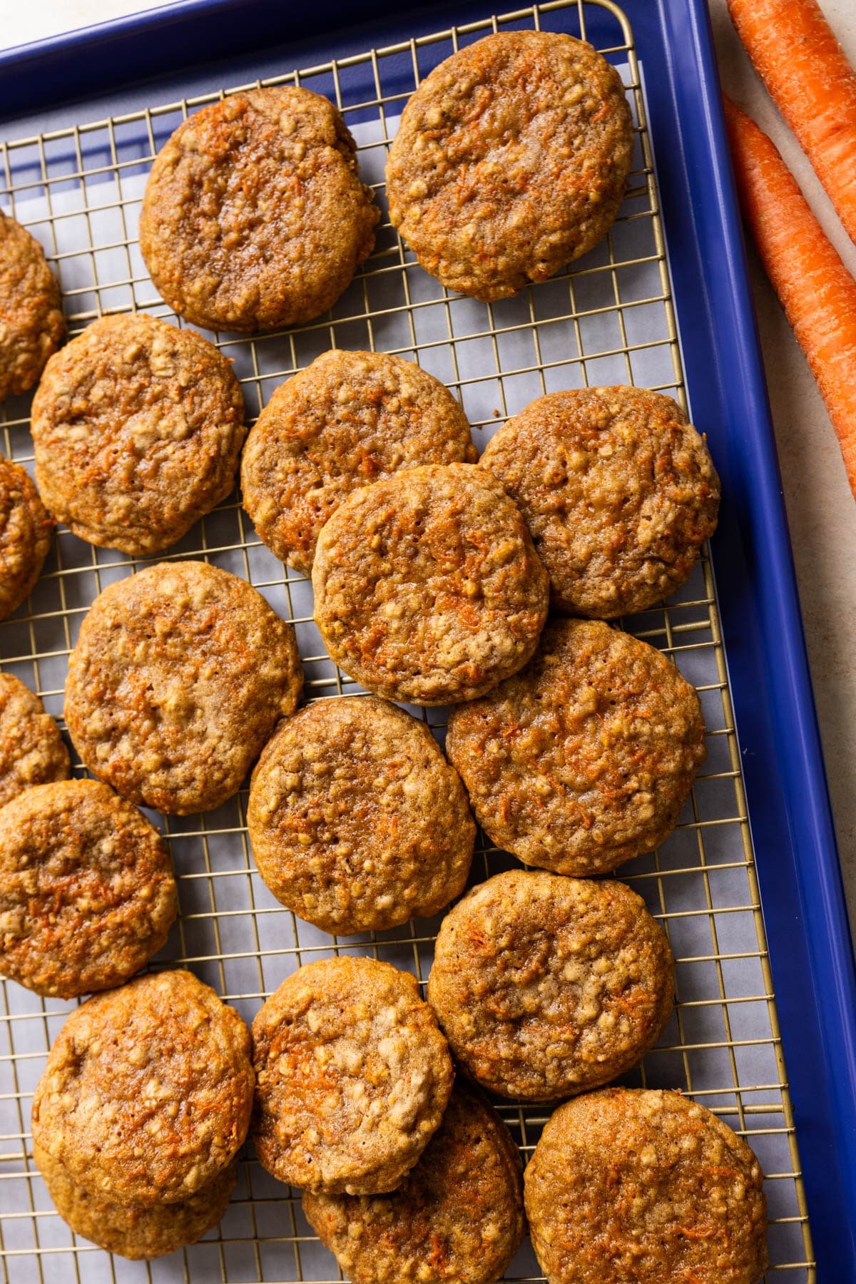 carrot cake cookies on a cooling rack. 