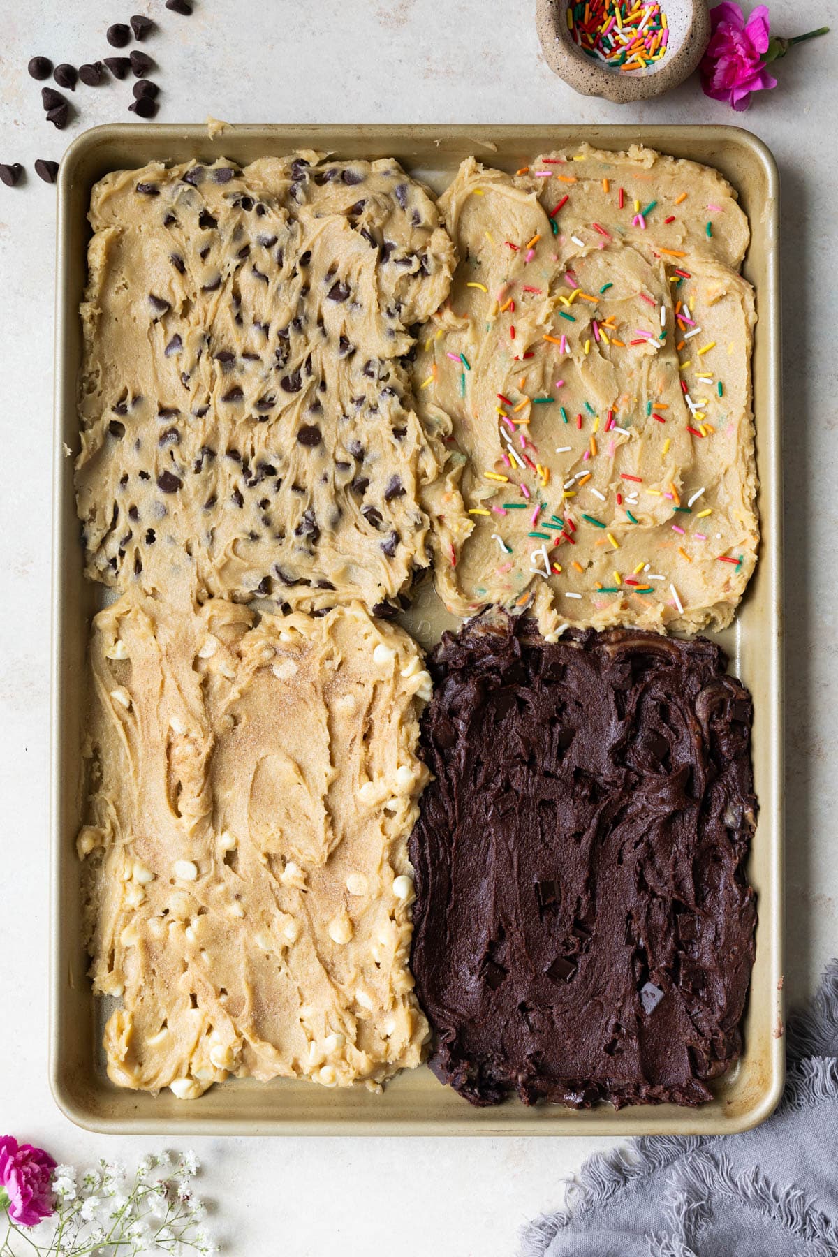 cookie dough on a gold cookie sheet. 