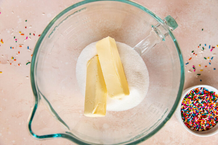 sugar and butter in a glass mixing bowl.