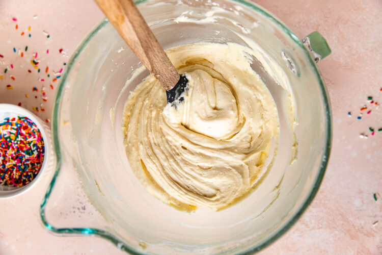 cream cheese buttercream frosting in a glass mixing bowl.