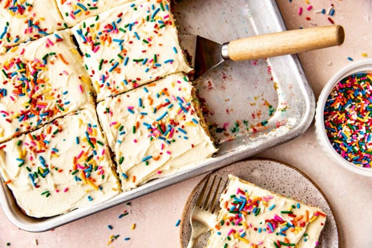funfetti cake being served onto speckled plates.