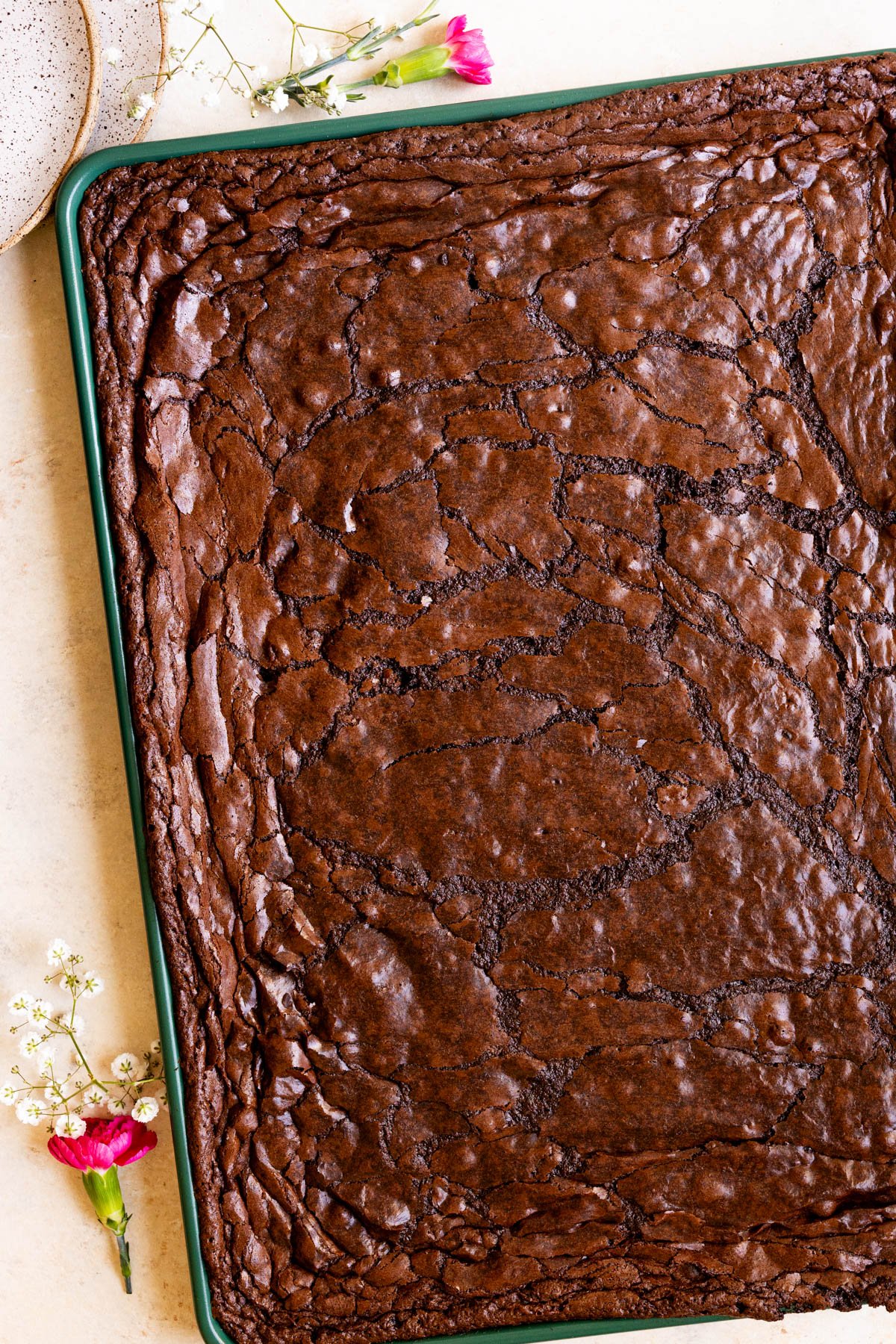 a sheet pan of freshly baked brownies. 