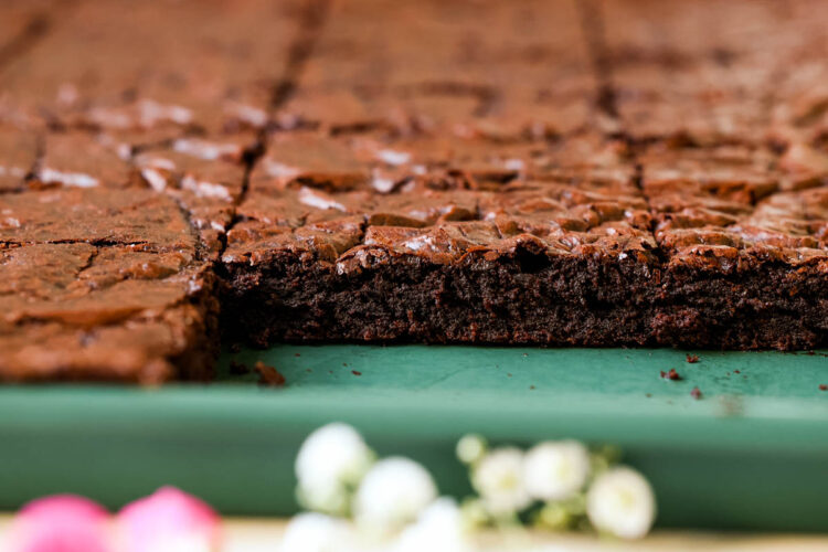 brownies on a green sheet pan.