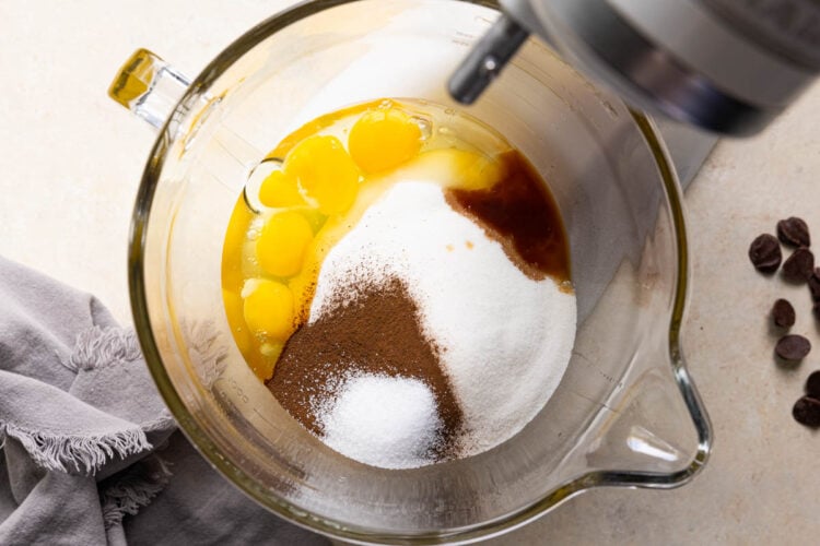 eggs, sugar. espresso powder, vanilla and salt in a glass bowl in a stand mixer.