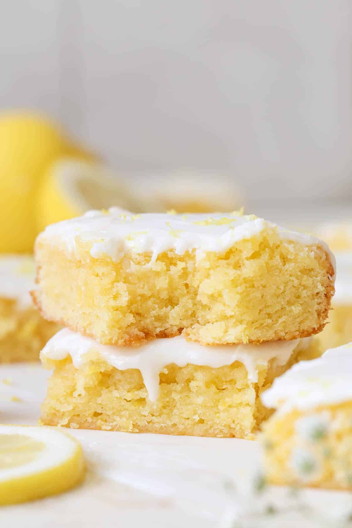 lemon brownies stacked on top of each other. 