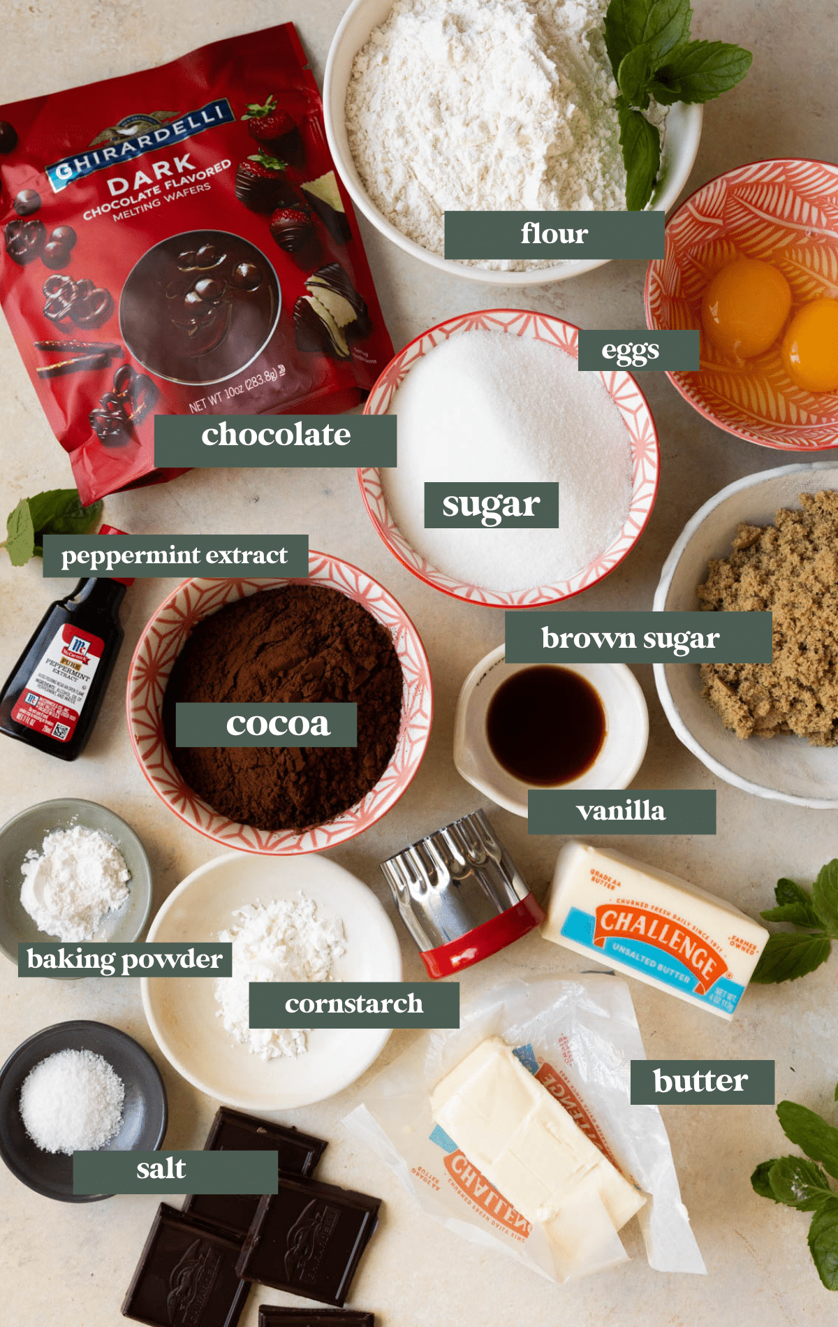 ingredients in small glass bowls needed to make thin mint cookies. 