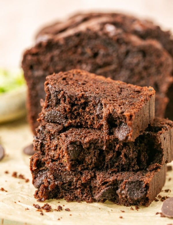 double chocolate zucchini bread sliced on parchment paper.
