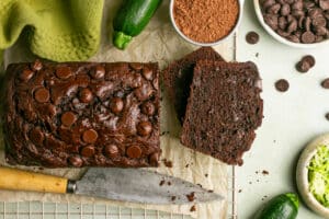 double chocolate zucchini bread sliced on parchment paper.