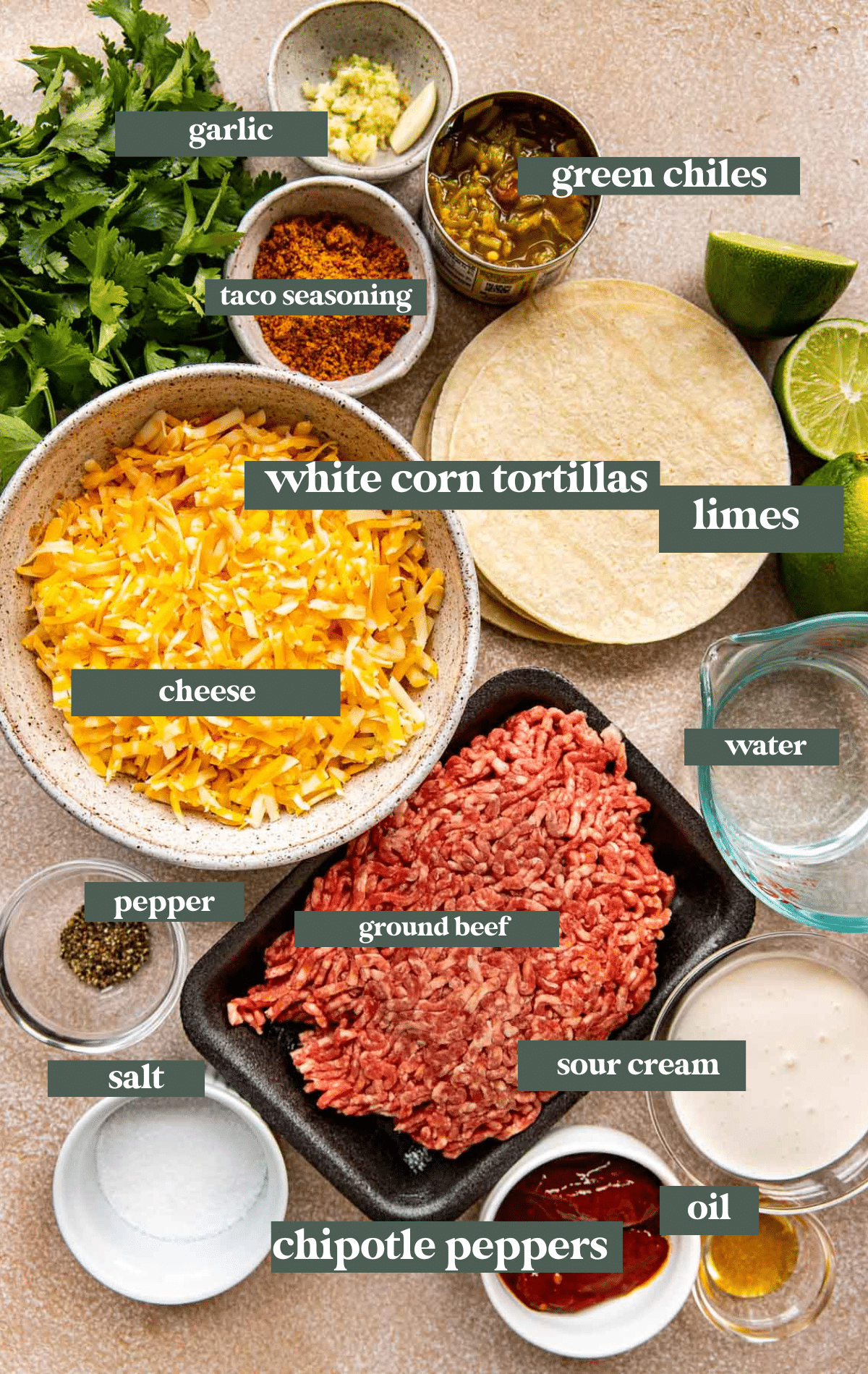 ingredients needed to make beef tacos in small glass bowls. 