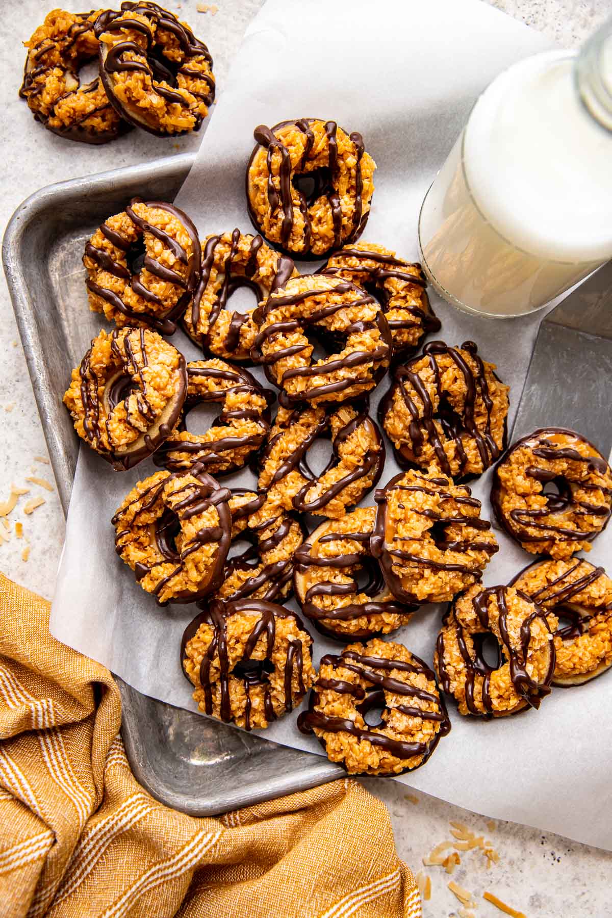 homemade samoas cookies on parchment paper. 