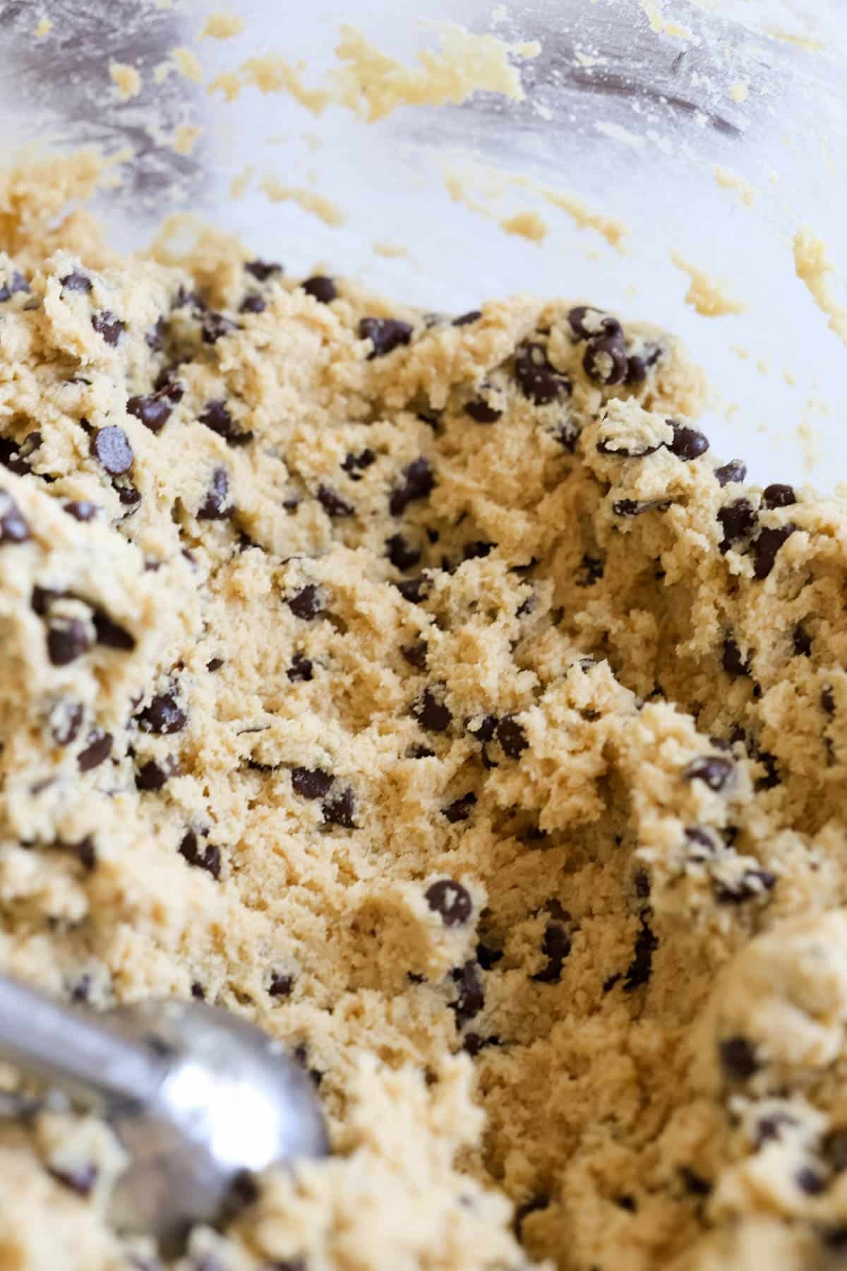 a close up image of chocolate chip cookie dough. 