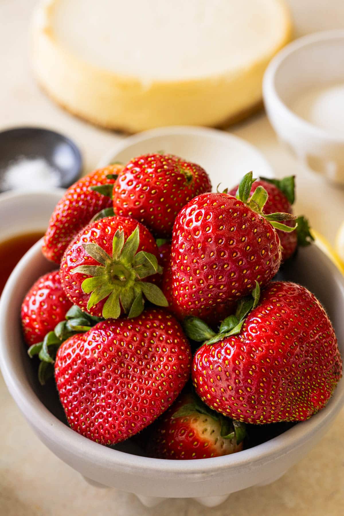 fresh strawberries in a glass bowl. 