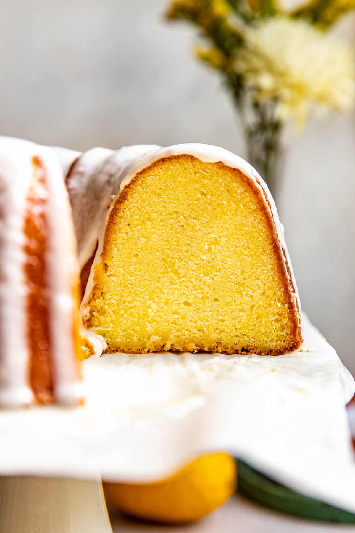 a close up image of a slice of pound cake made with lemons.