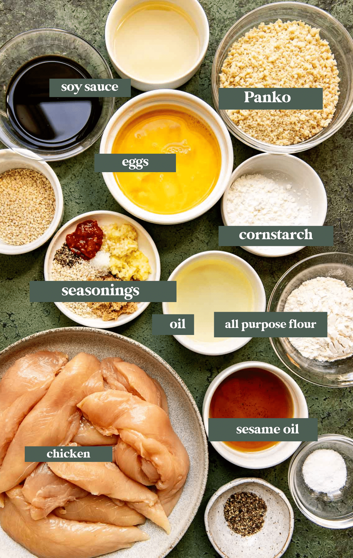 ingredients needed to make sesame chicken in small glass bowls. 