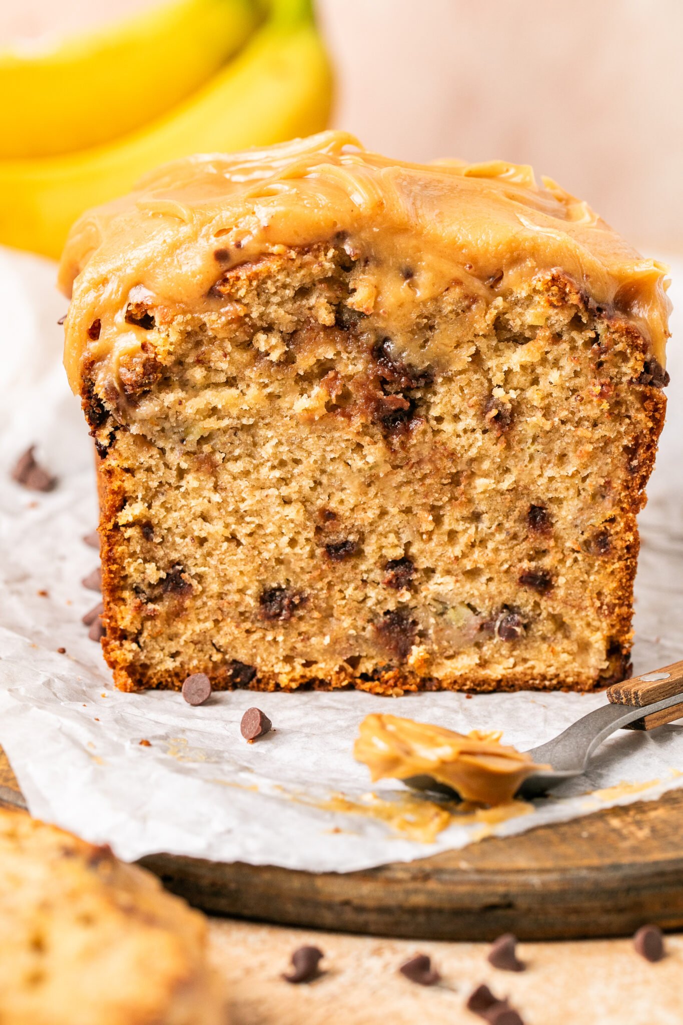 up close image of peanut butter banana bread with peanut butter frosting. 