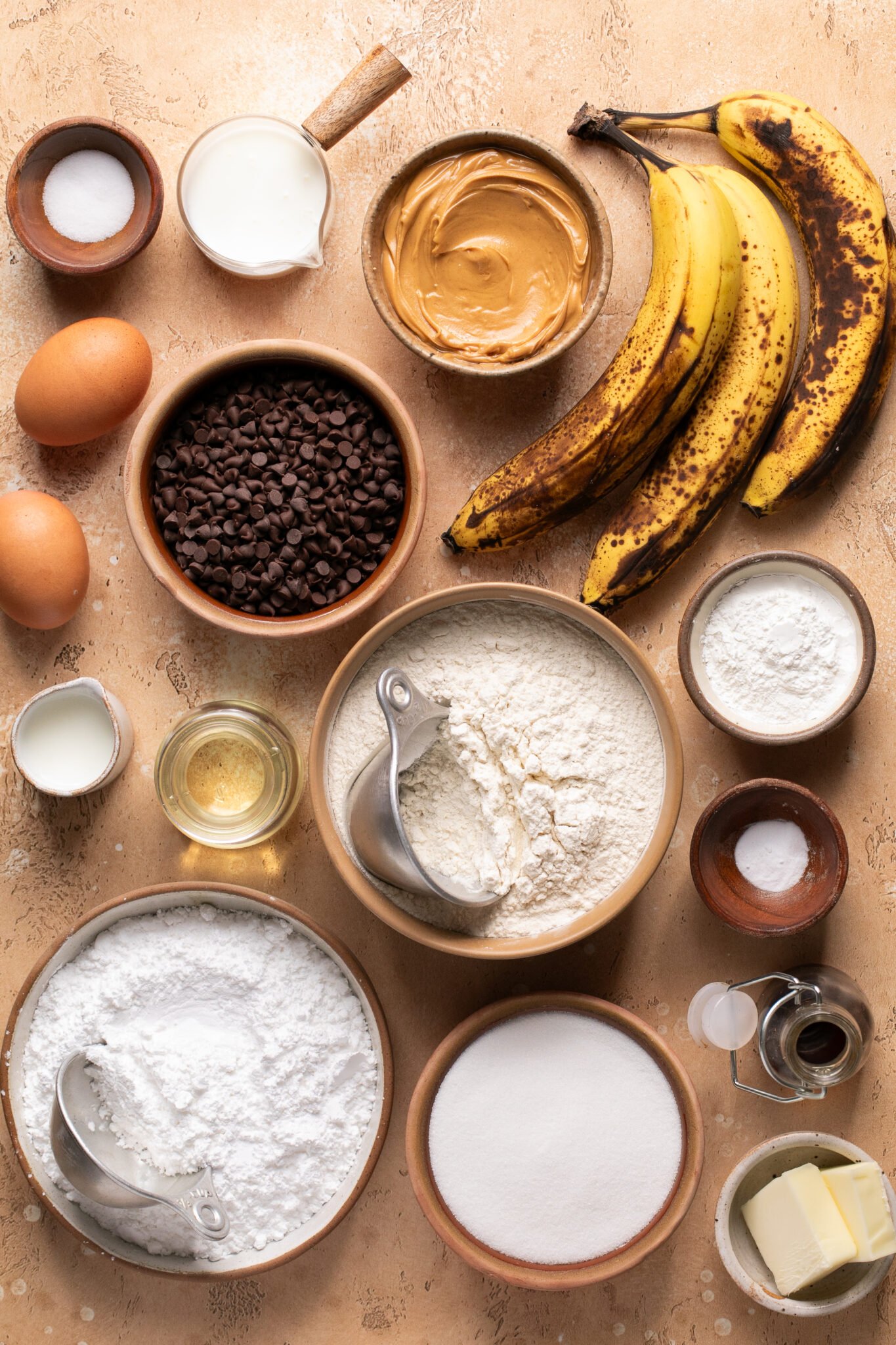 ingredients in small dishes needed to make banana bread. 