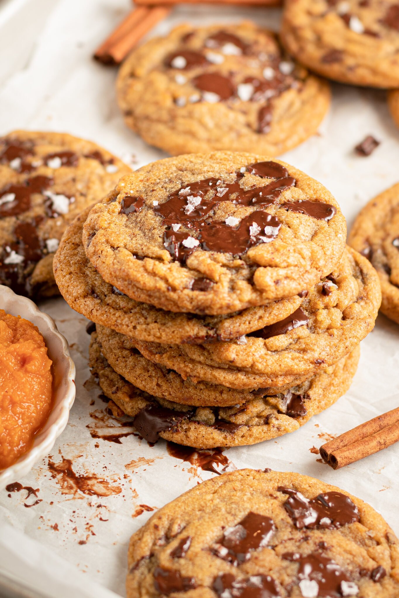 a stack of cookies made with pumpkin and chocolate.