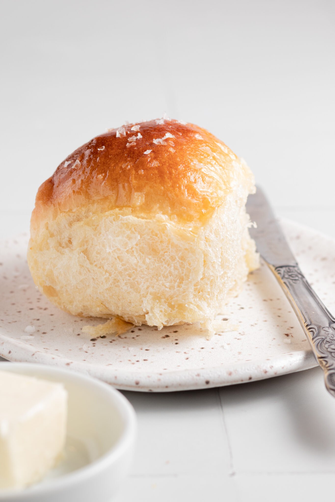 dinner roll on a plate. 