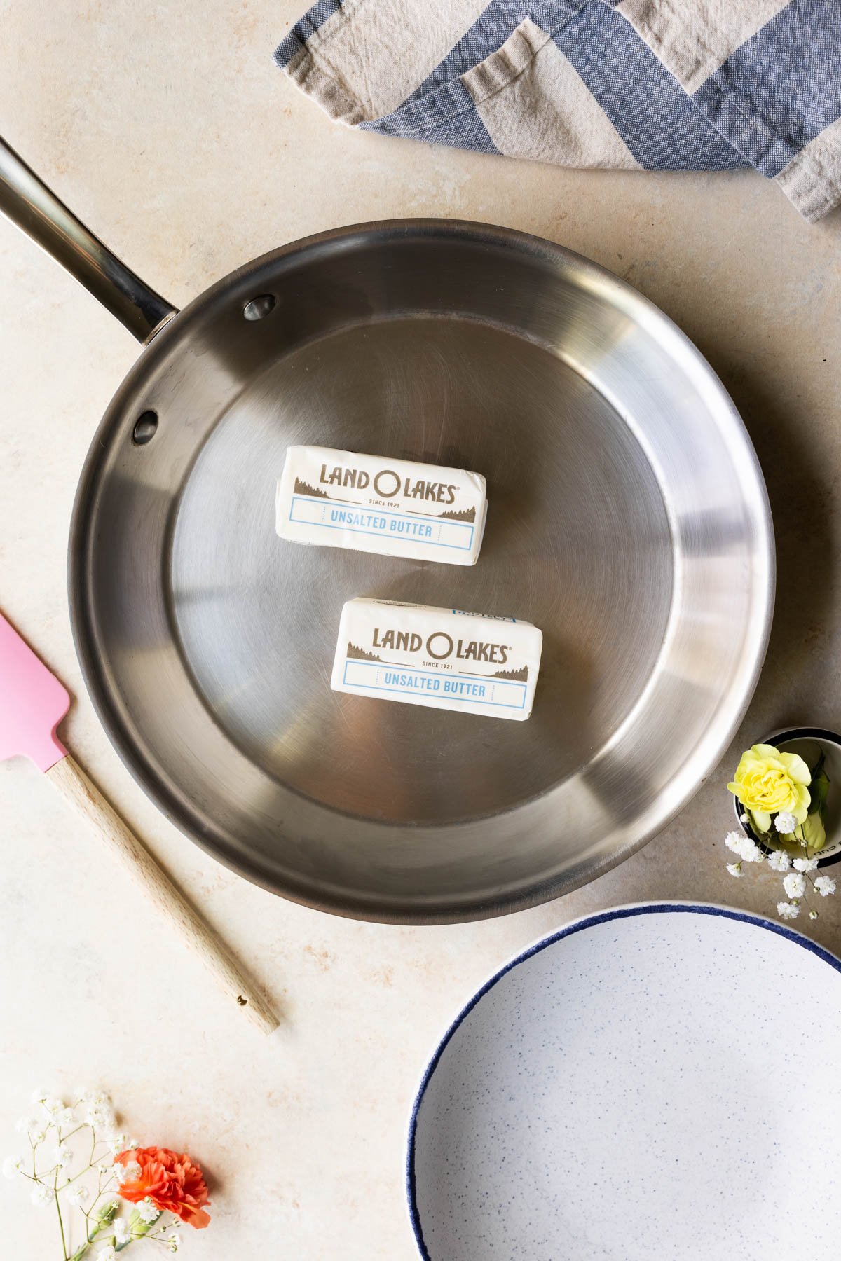 a stainless steel skillet with butter in it. 