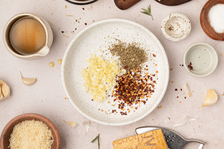 garlic and seasonings in bowl for bread dipping oil.