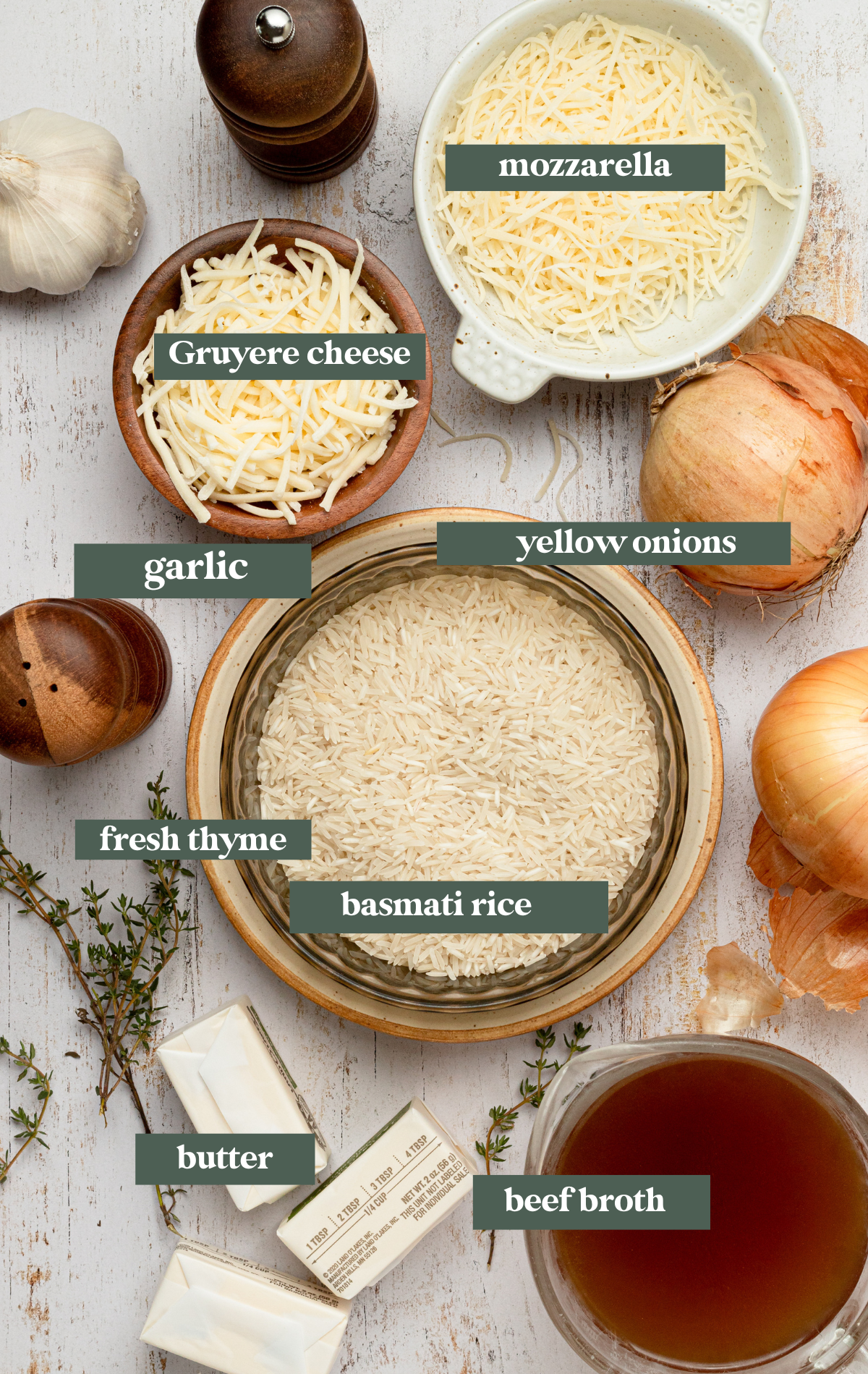 Ingredients needed to make French onion pilaf in small glass bowls. 