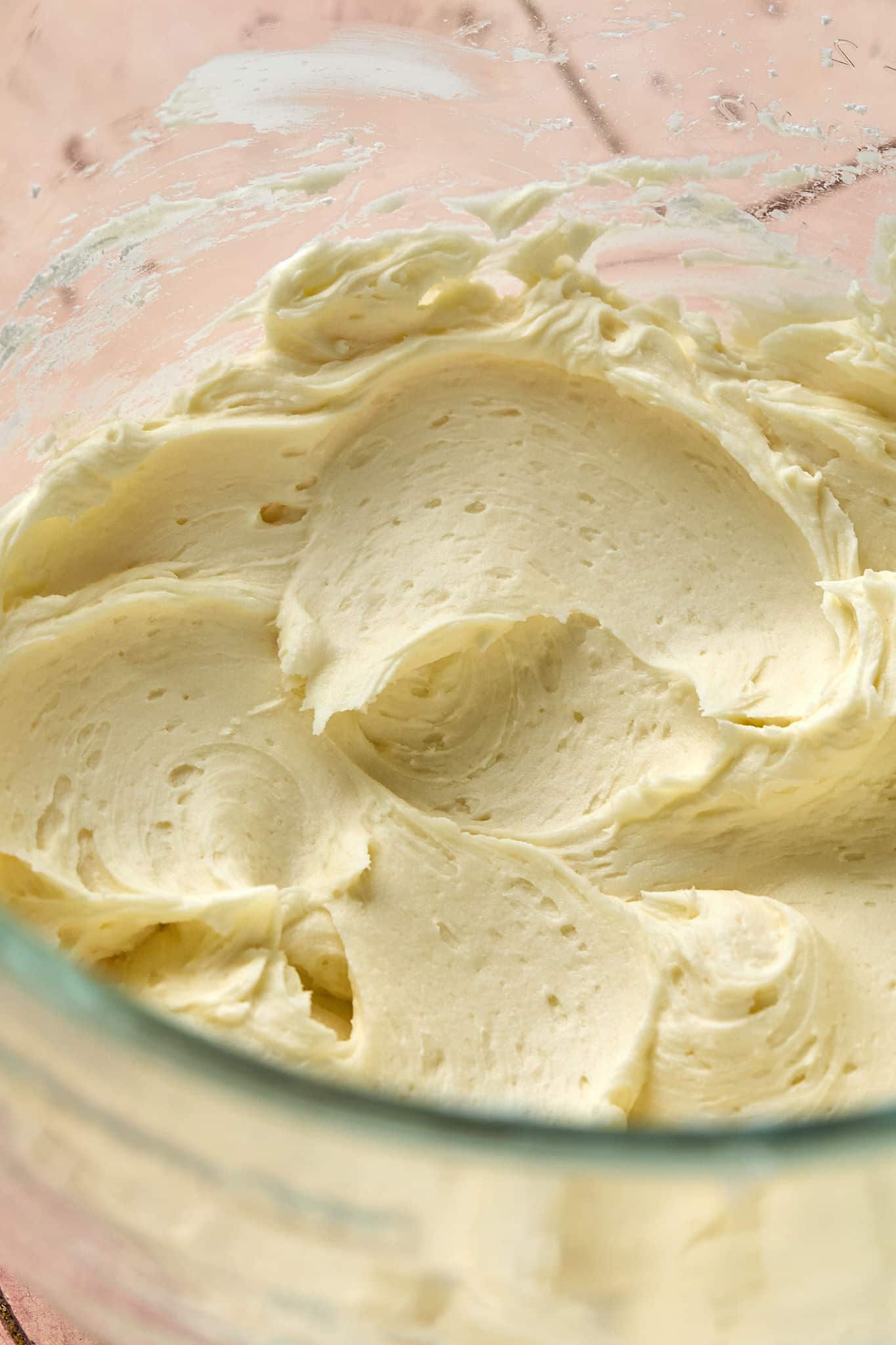 clear bowl with thick, cream colored frosting