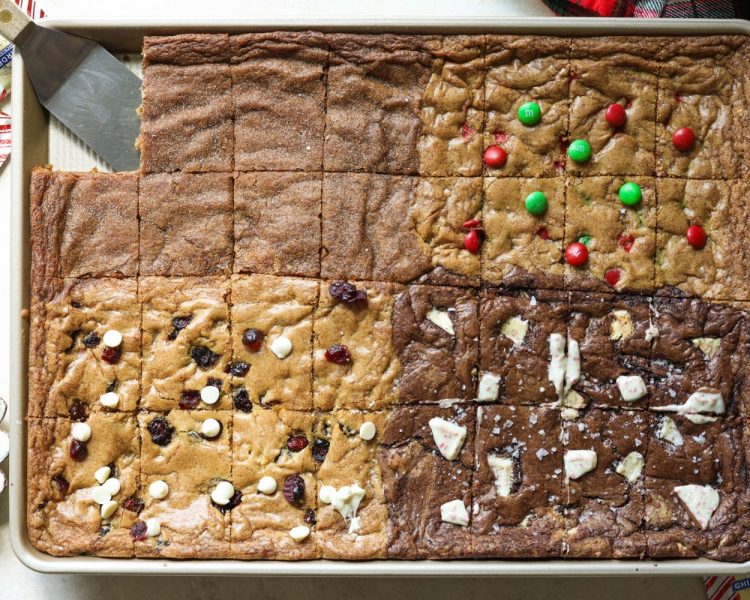 four different types of baked cookies on a sheet pan with slices cut