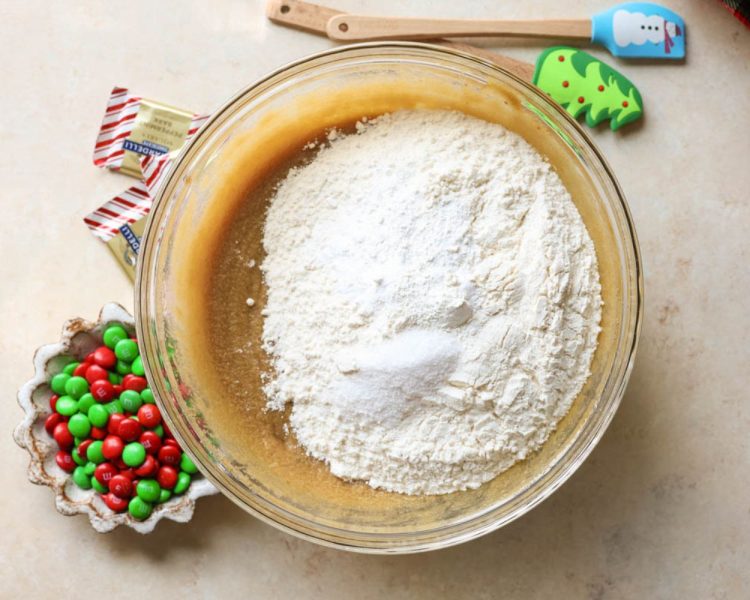 clear mixing bowl with dry ingredients on top of wet ingredients