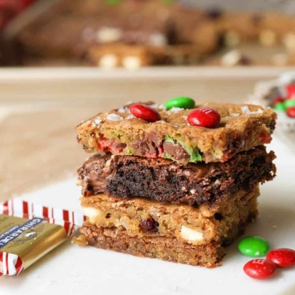 four cookies stacked on top of each other on a white dish