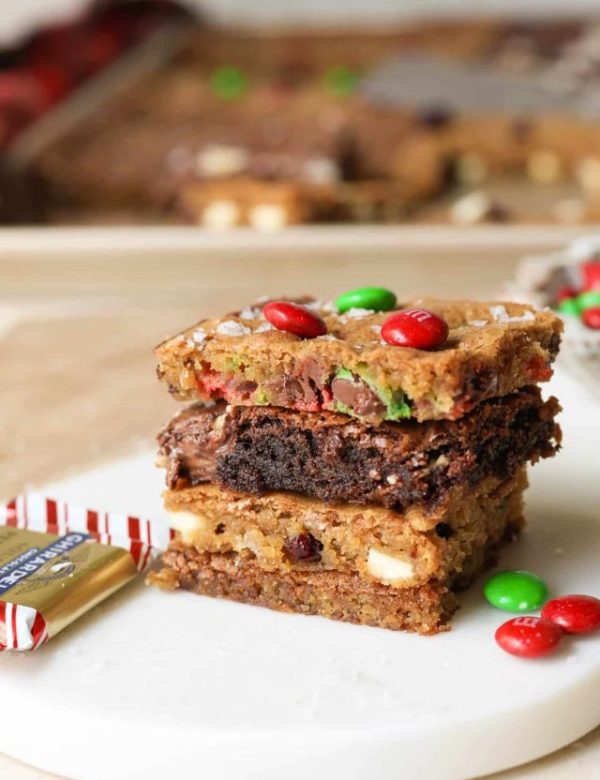 four cookies stacked on top of each other on a white dish