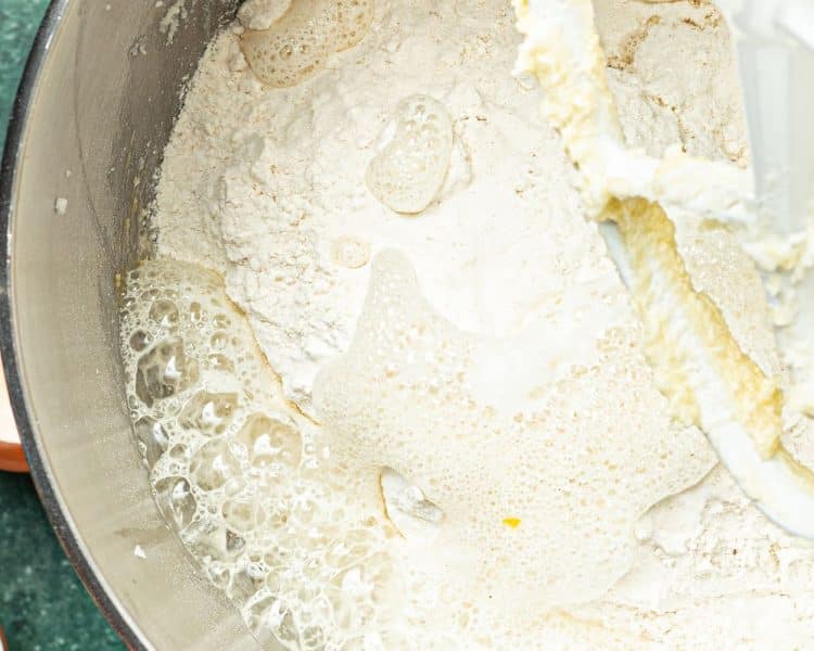 mixing bowl with dry ingredients and lemon juice bubbling with baking soda