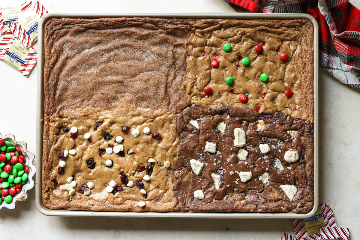 gold sheet pan with four types of cookies