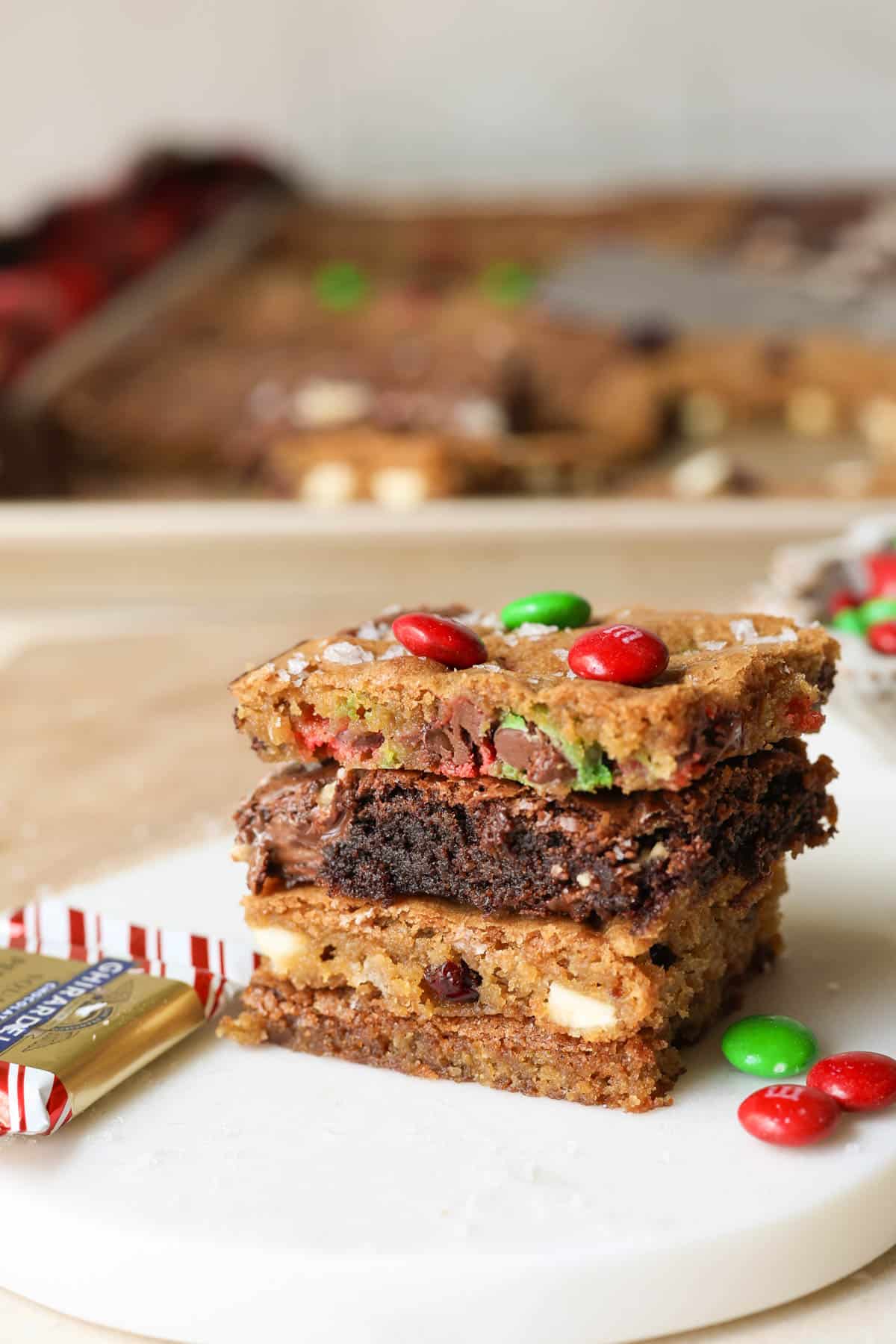 four cookies stacked on top of each other on a white dish