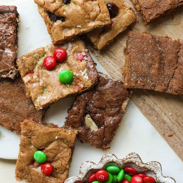 cookies cut into rectangles and a bowl of red and green m&ms