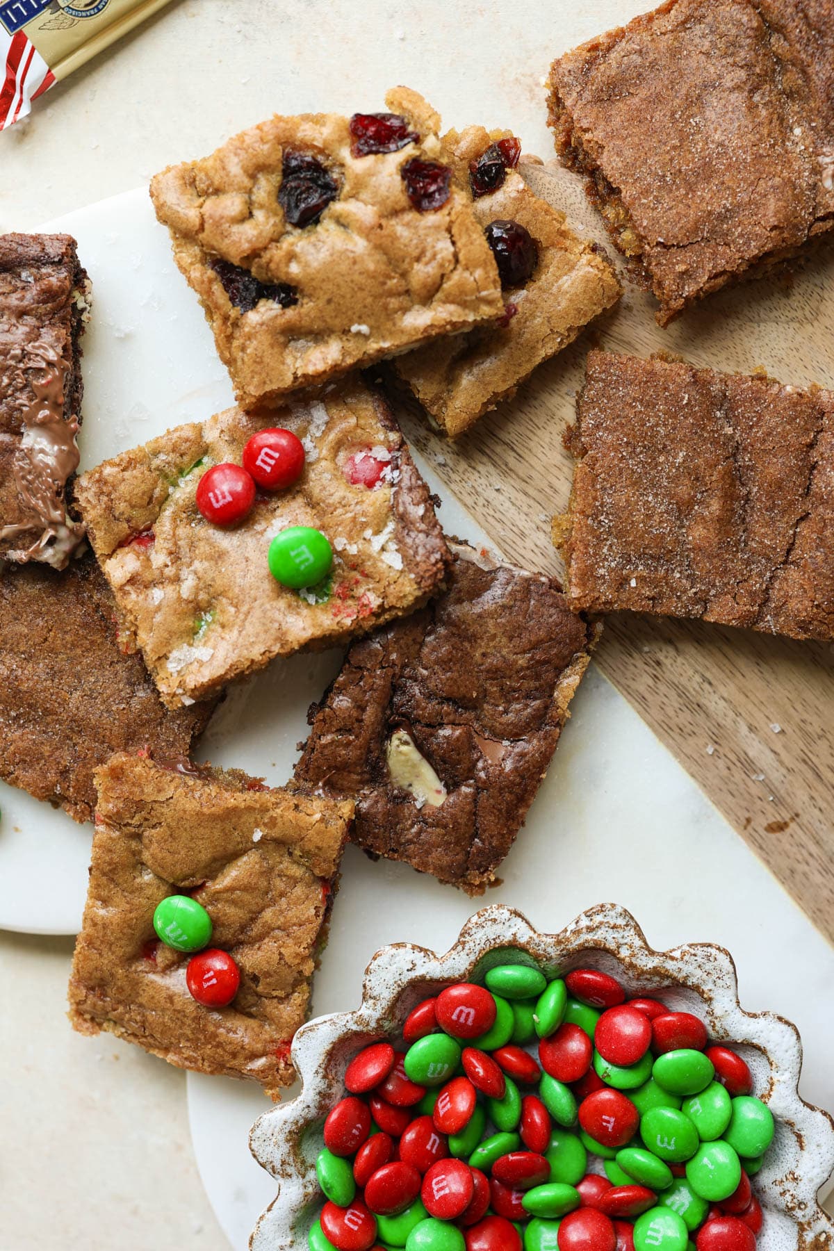 cookies cut into rectangles and a bowl of red and green m&ms