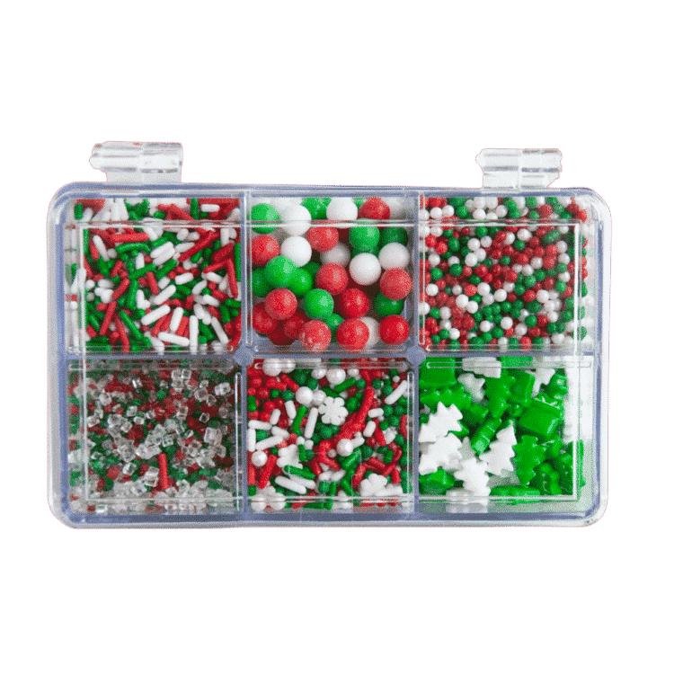 clear box with six compartments filled with red, white, and green holiday sprinkles