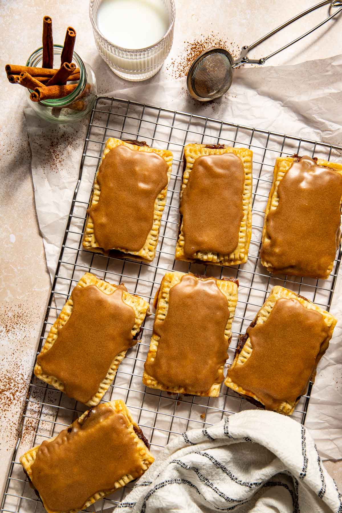 brown sugar pop tarts in a lined baking sheet. 