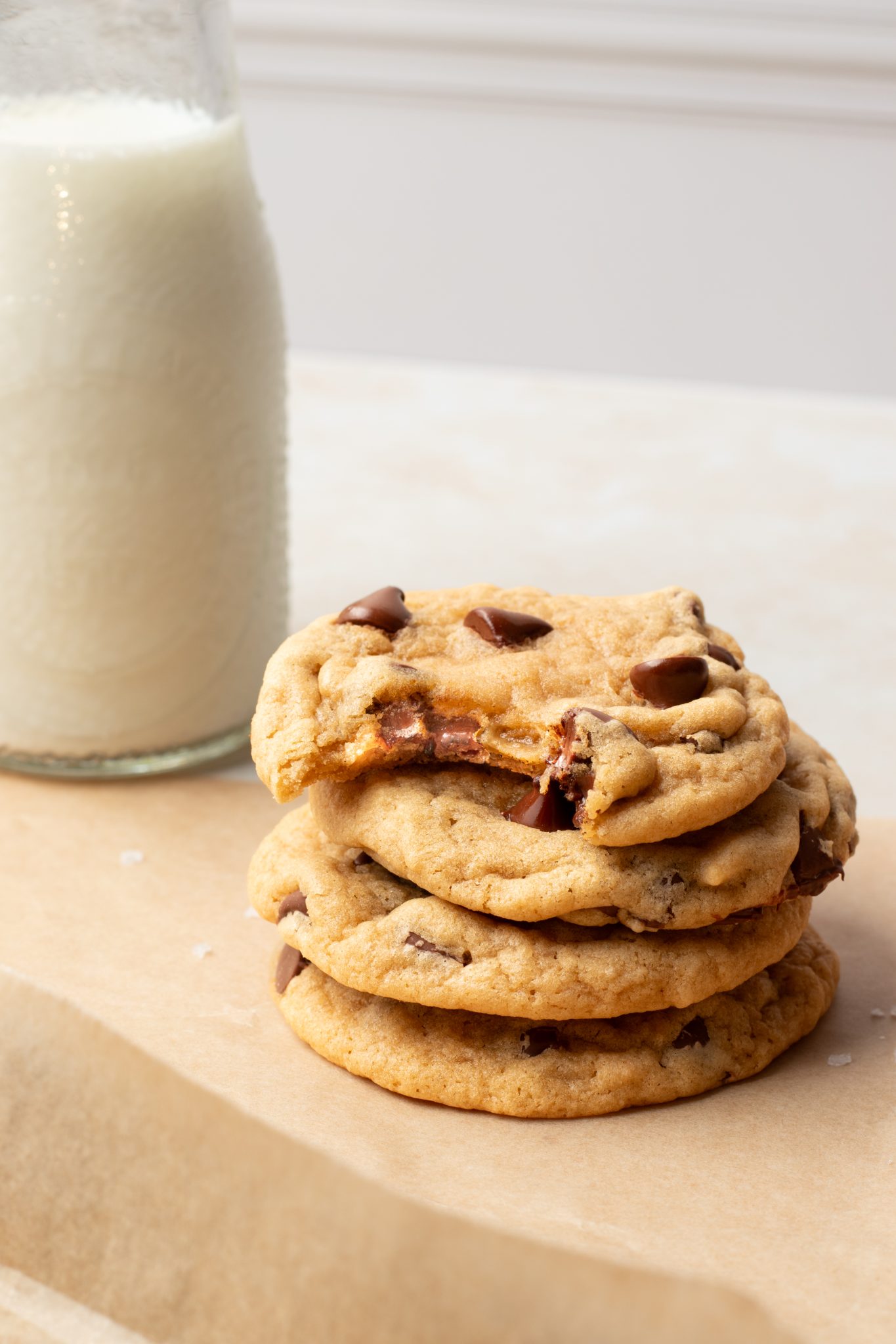 stacked cookies with a bite taken out of the top cookie. 