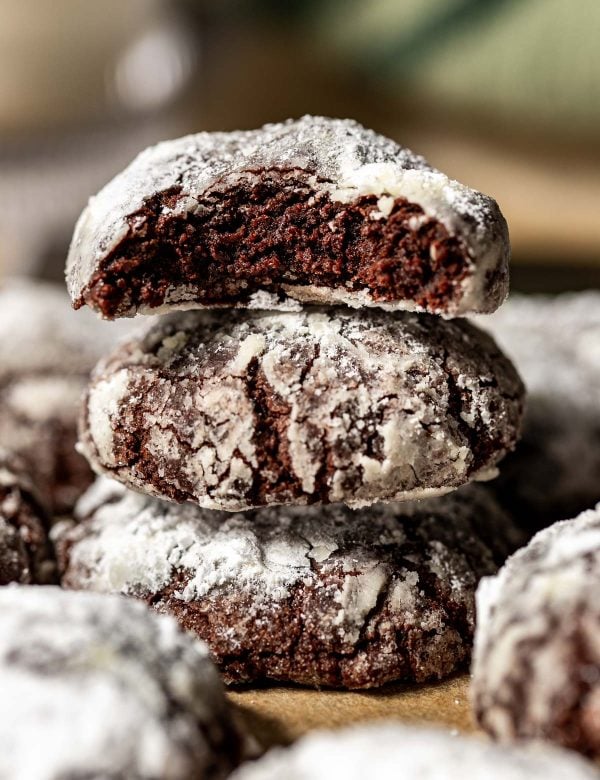 crinkle chocolate cookies stacked on top of each other.