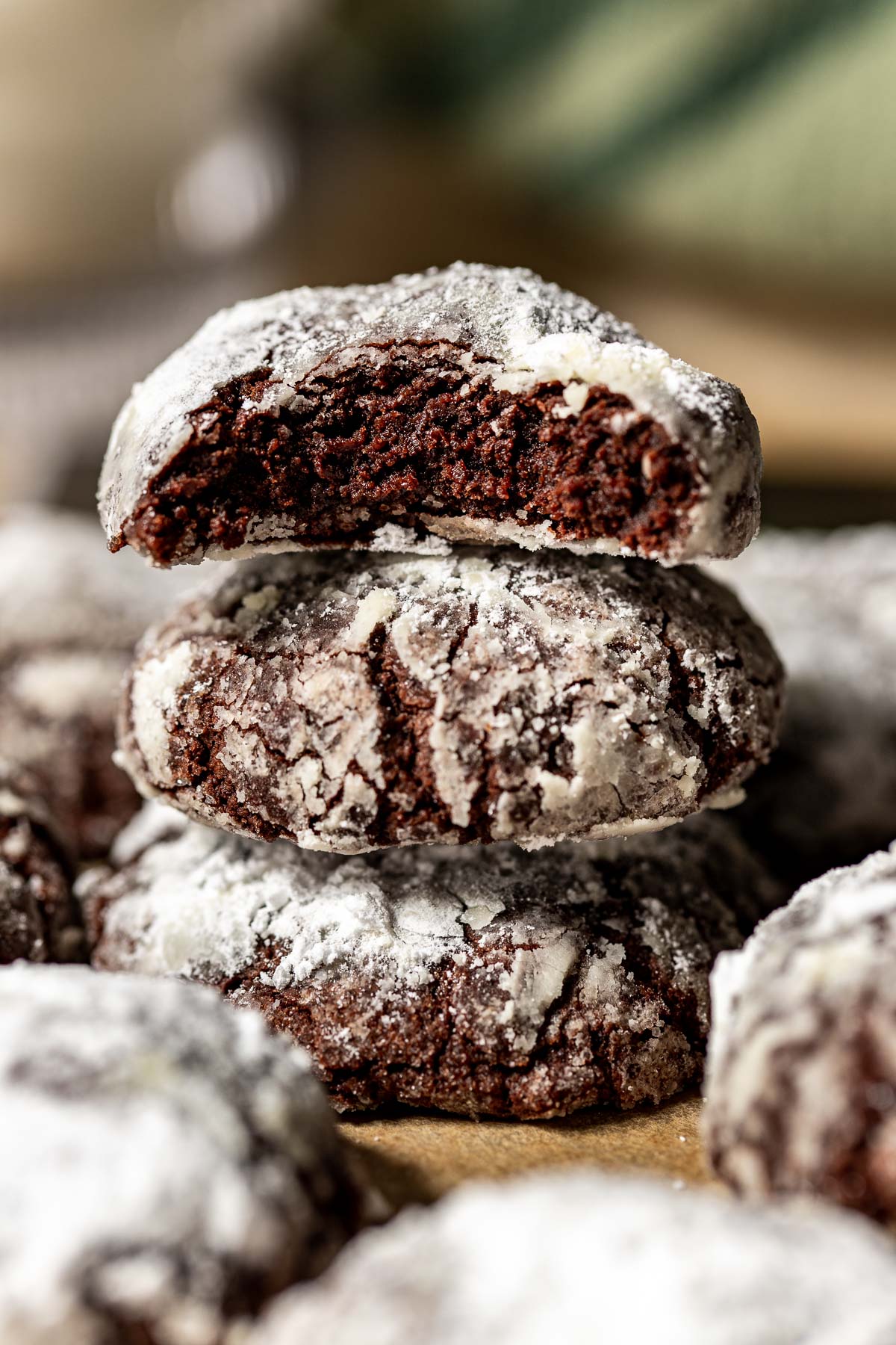 crinkle chocolate cookies stacked on top of each other.