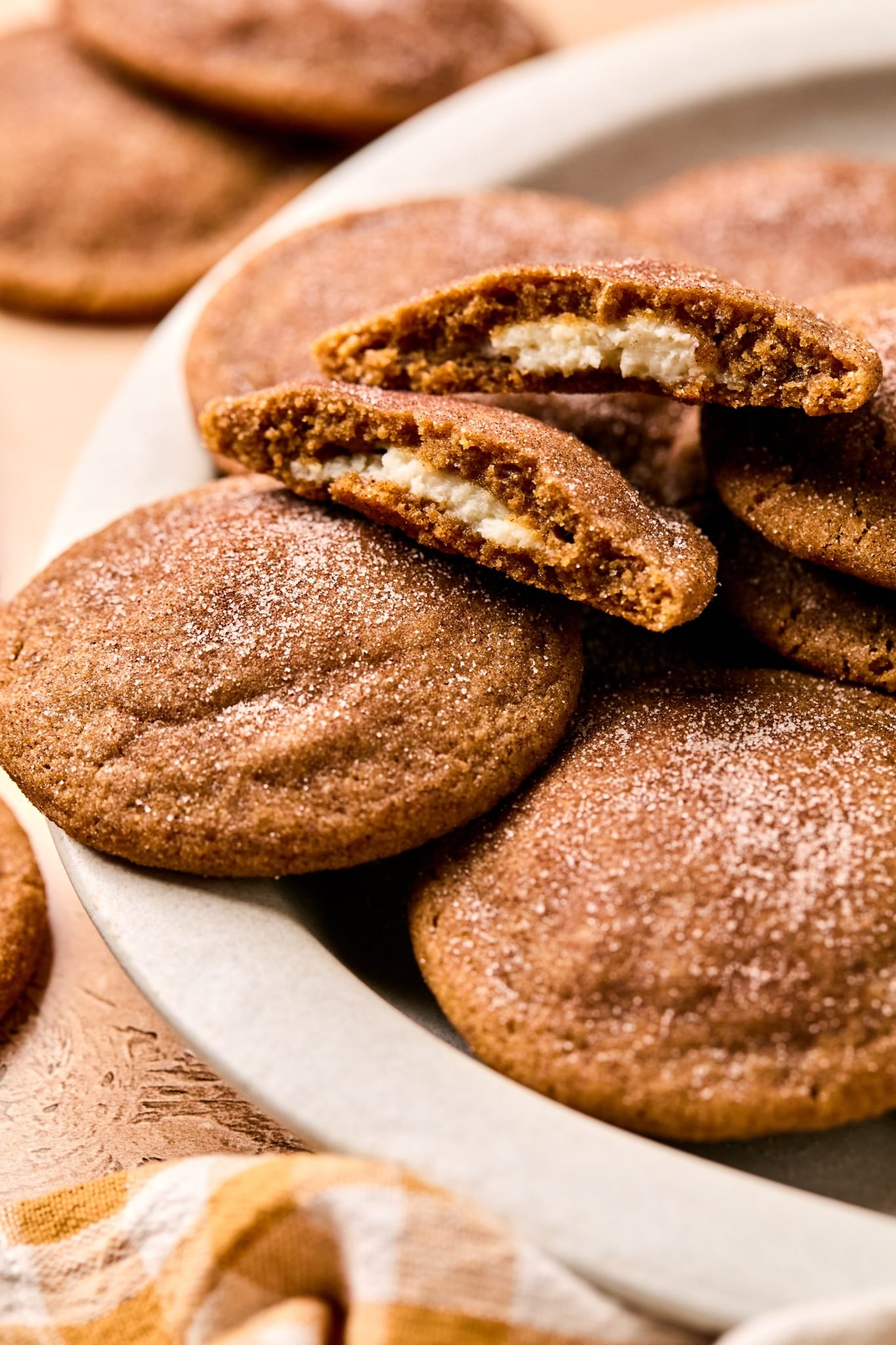 cheesecake inside of a gingerbread cookie sprinkled with cinnamon and sugar. 