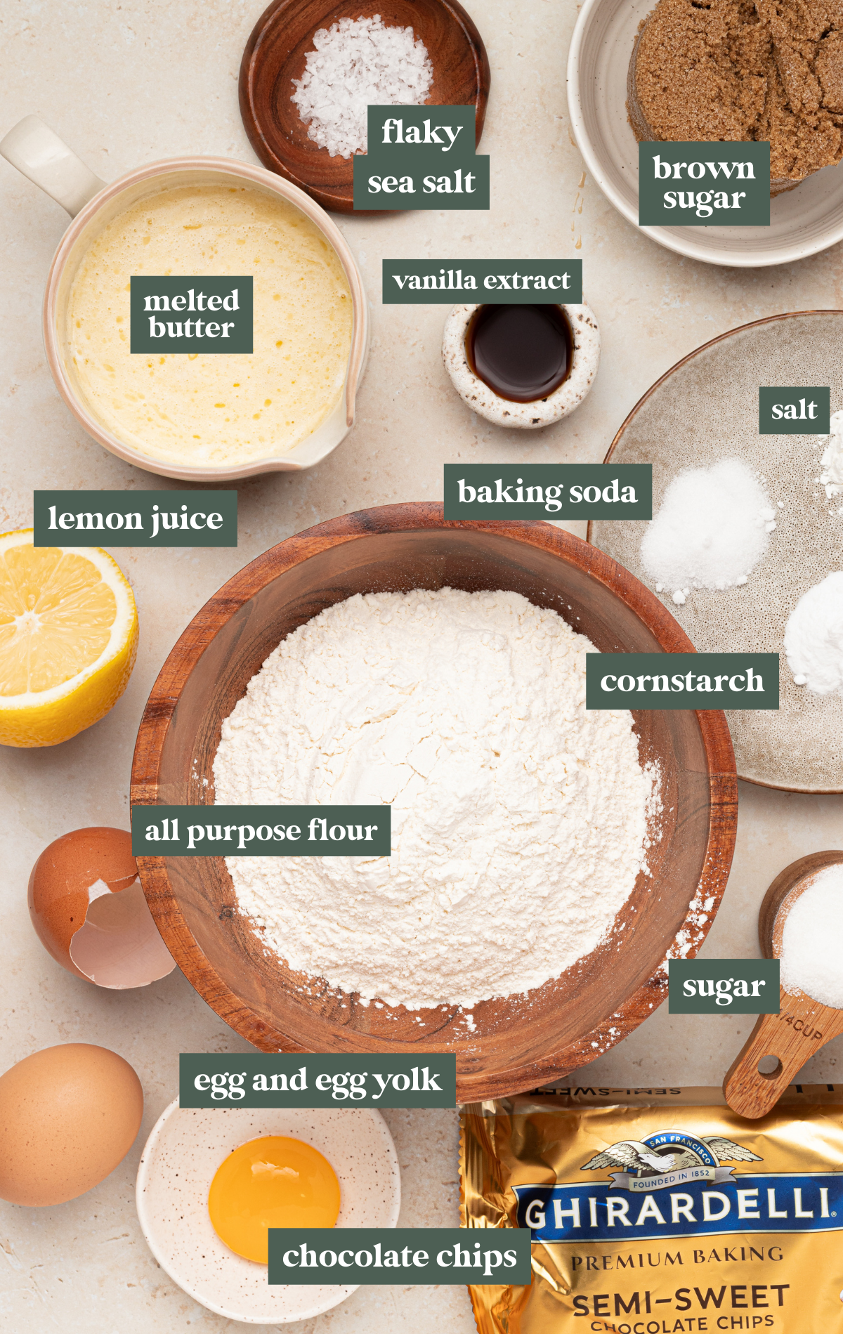 ingredients to bake cookies in small glass bowls and wooden bowls.